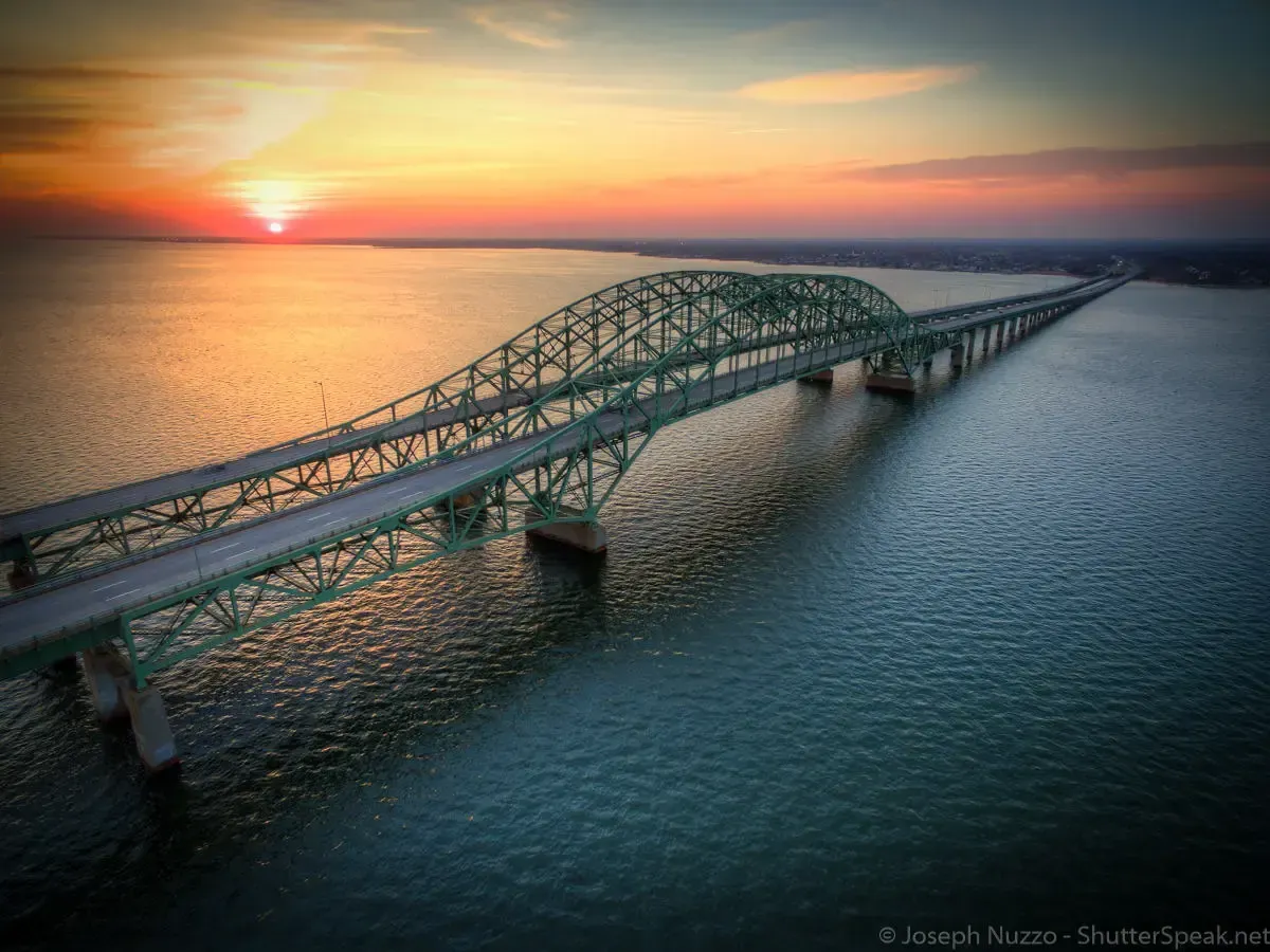 Aerial view of the Robert Moses Bridge and the Great South Bay with the sunset in the background